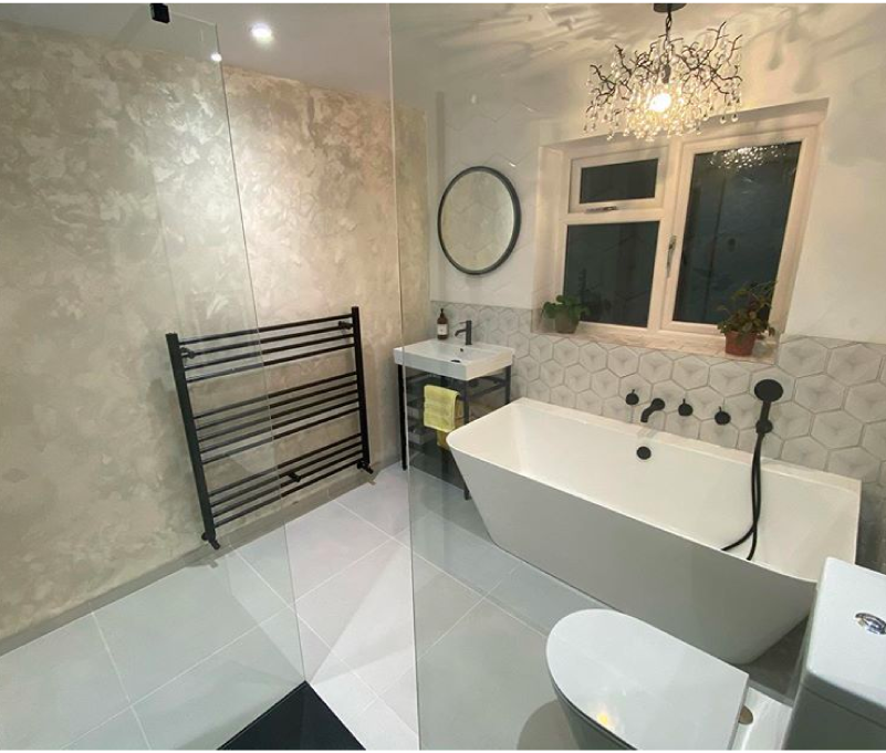 Bathroom suite featuring Milano Nero matt black bathroom products with modern freestanding bath.