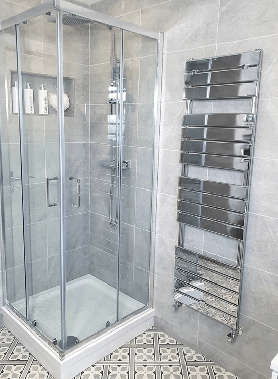 Milano Portland corner bi-fold shower door enclosure and Milano Lustro chrome flat panel designer heated towel rail 